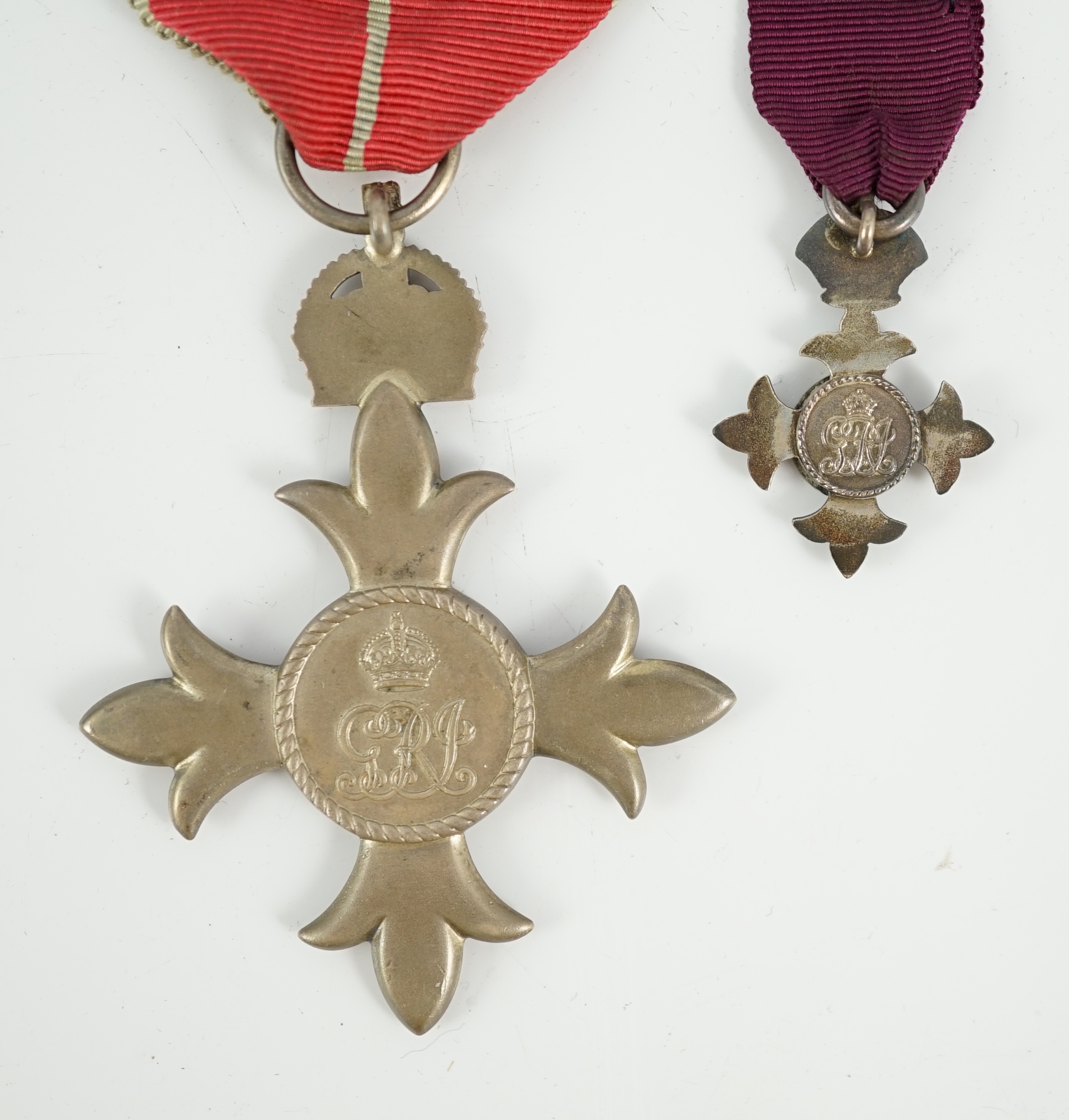 A cased George V military MBE containing leaflet with instructions as to wearing Insignia, together with the separately cased miniature
